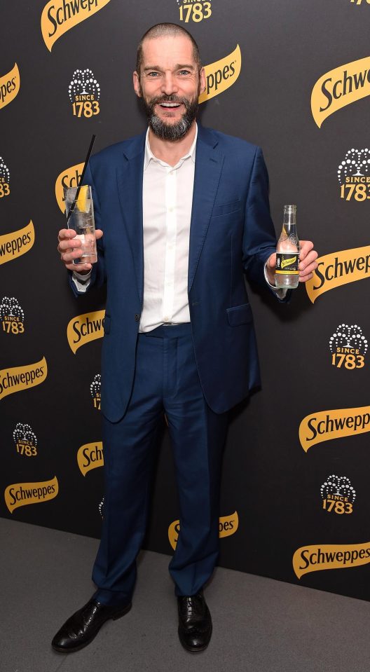 Fred grabbed a Schweppes mixer and struck a pose