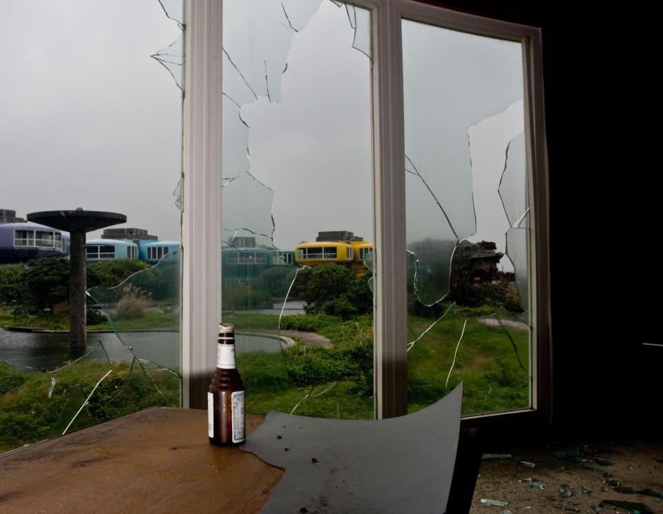  The floor-to-ceiling windows are smashed and the site is covered in graffiti