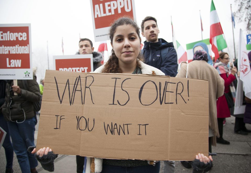  Activists chanted 'drop aid not bombs' and waved placards