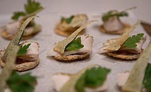  Grilled chicken was served on melba-style toast with a spiced sauce and a sprinkling of herbs