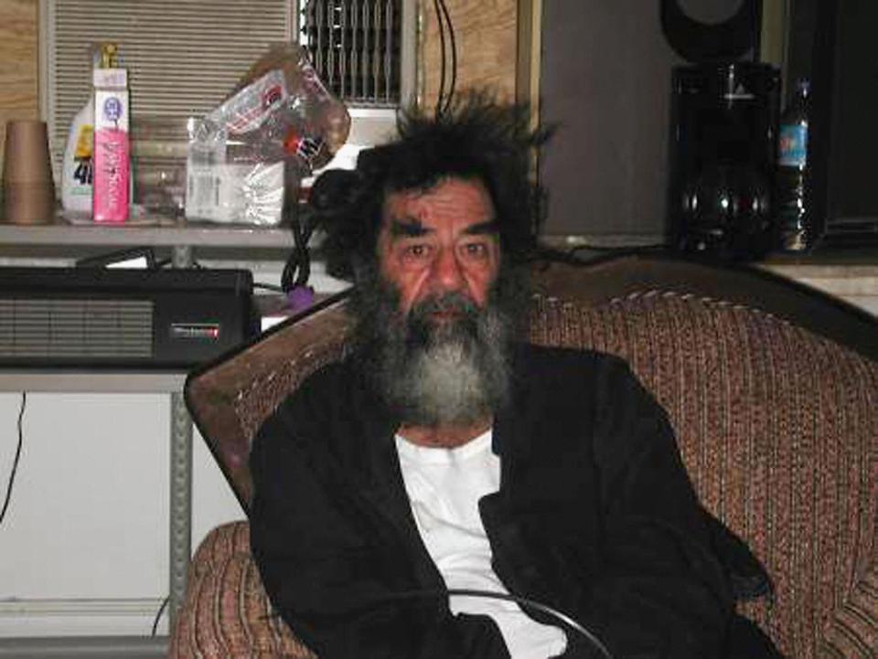  Saddam Hussein, pictured following his capture, warned a CIA agent that Iraq was not easy to govern