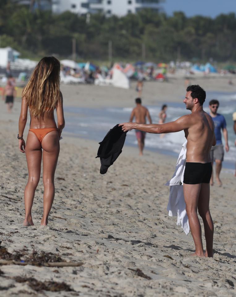  Helping hand: Natalia and a friend were on the beach in Miami in December