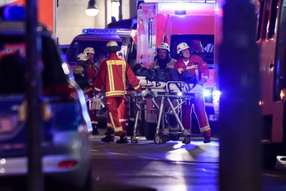  Paramedics work at the scene of the attack