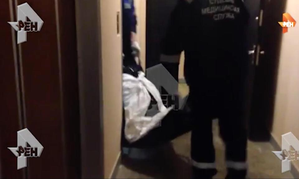  Russians Ren TV showed footage of Polshikov's body being carried from the crime scene