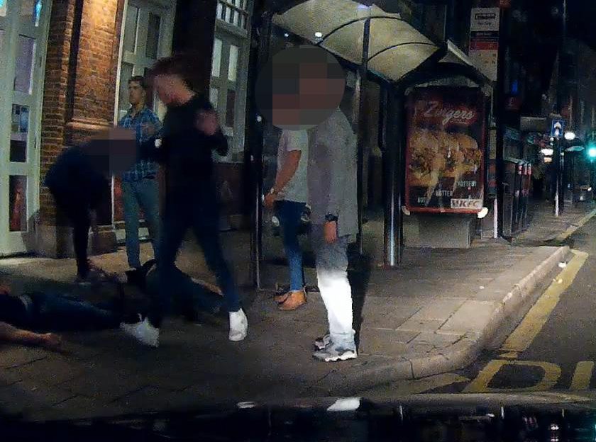  Thug Atkins walks away from the young man who is out cold on the floor after the shocking attack