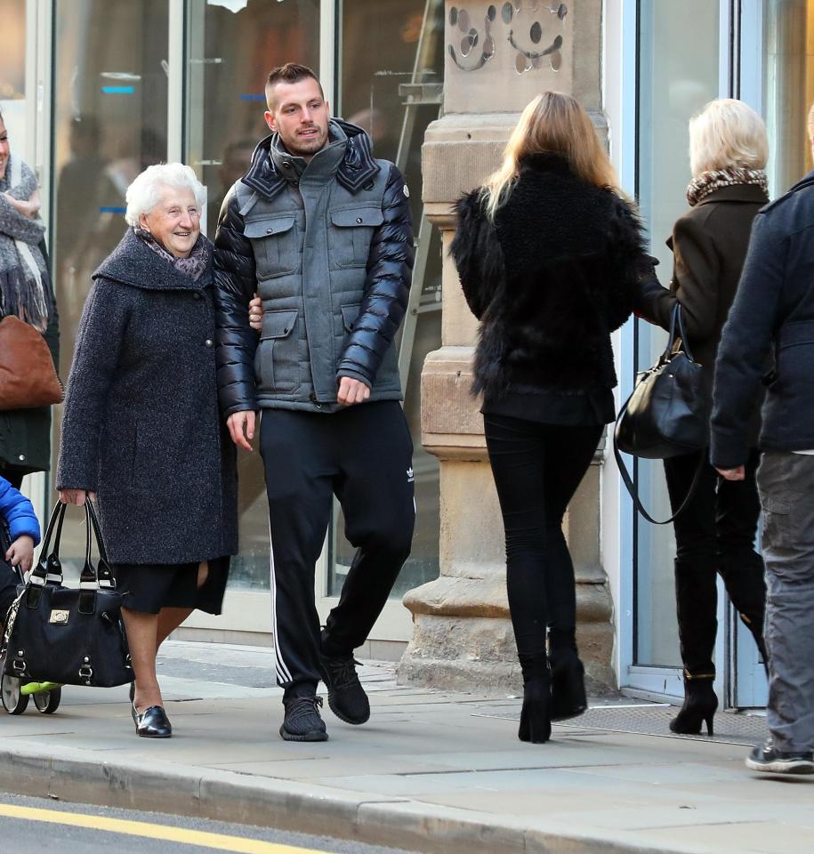 Morgan Schneiderlin is spotted heading into Manchester city centre with his family in tow