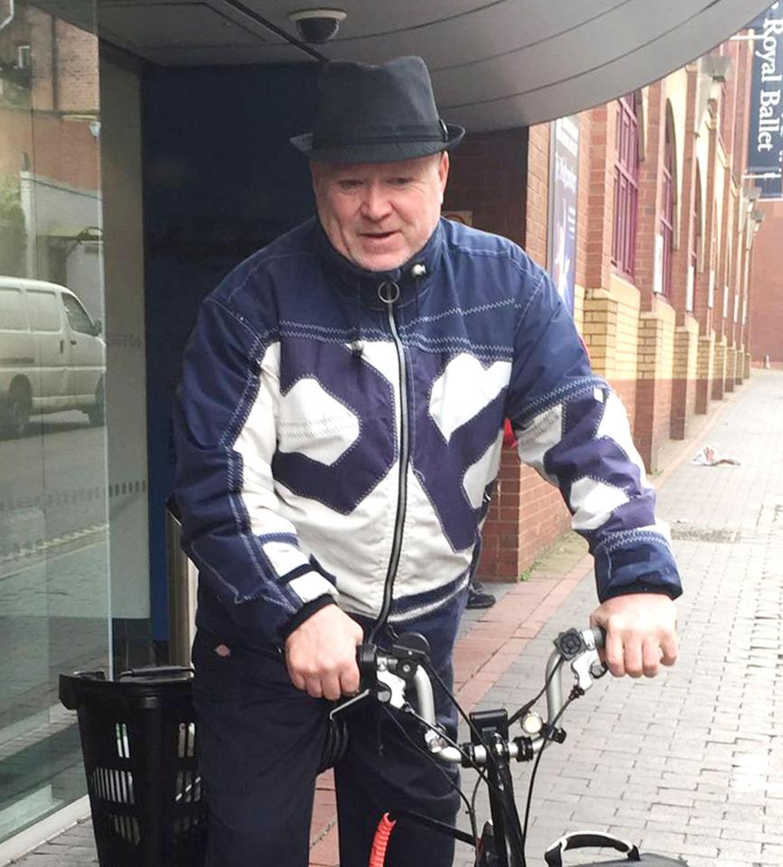  He wore a Trilby hat and eye-catching blue jacket for his commute