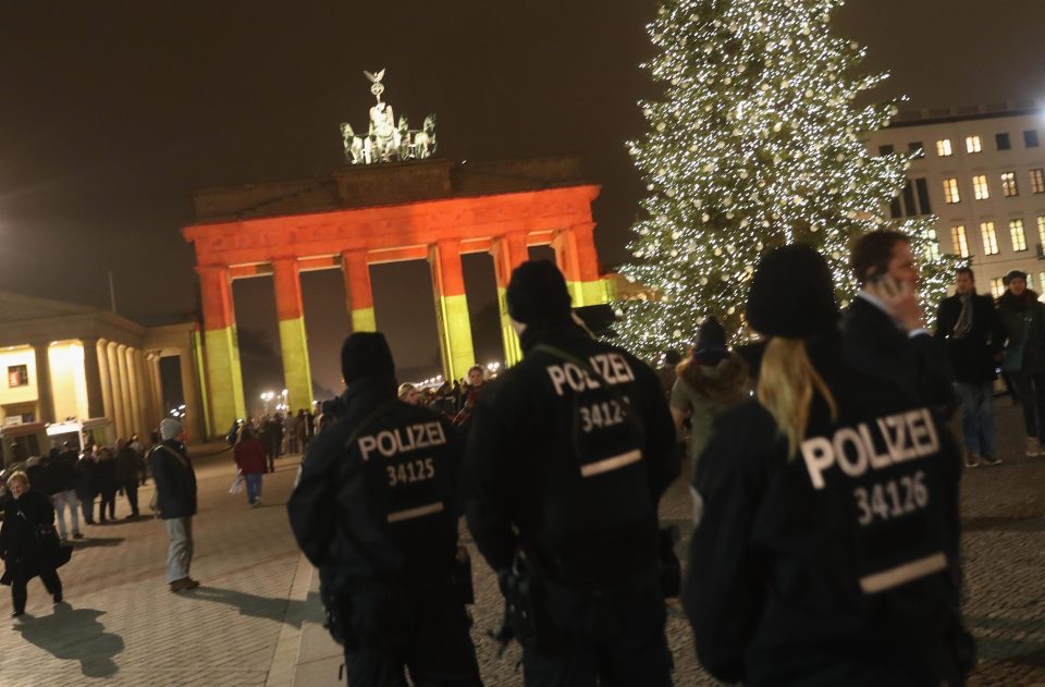  German police were last night desperately hunting for the attacker behind the attack. Here, cops patrol the area around Berlin's Brandenburg Gate