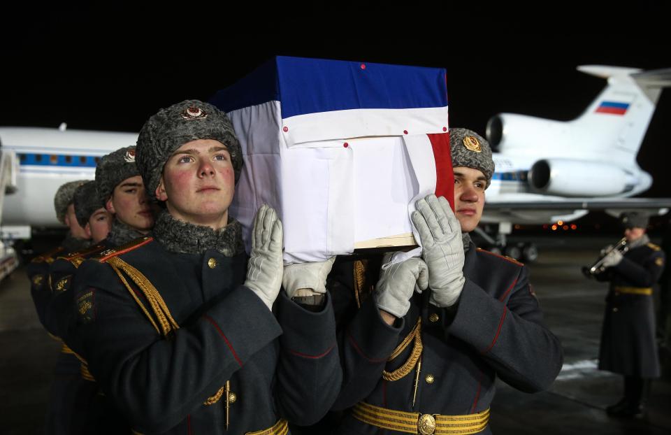  The body of Russia's Ambassador to Turkey Andrei Karlov is carried by members of the military