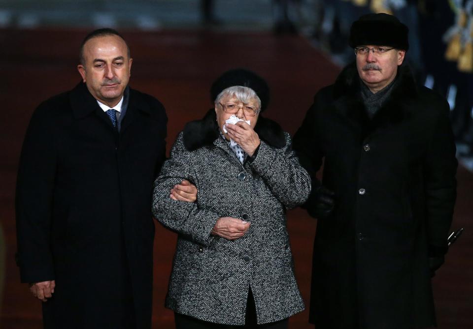  Turkey's Foreign Minister Mevlut Cavusoglu, left and Andrei Karlov's mother Maria, in the middle