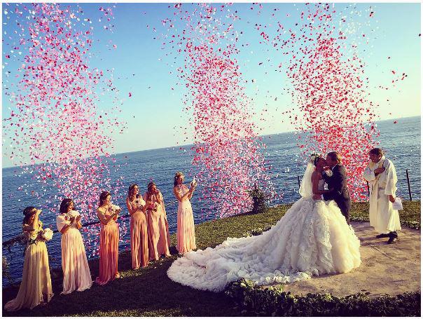 Confetti canons exploded as Giovanna Battaglia married Oscar Englebert in Capri, Italy