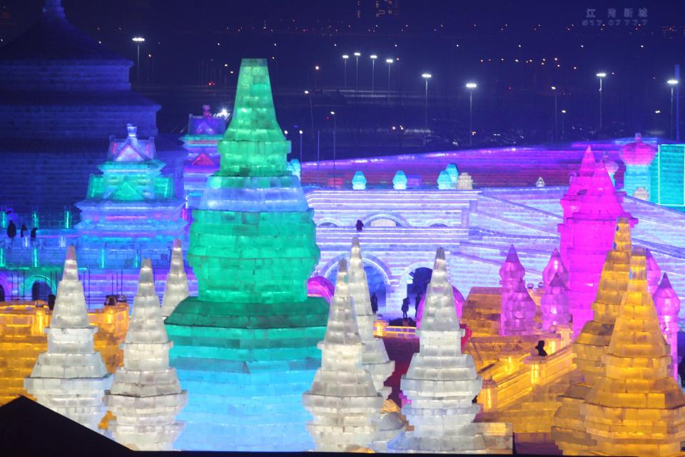 Buildings resembling the temples of SE Asia light up the night