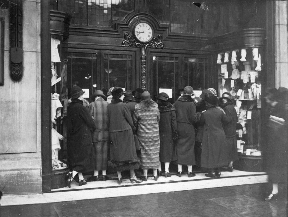  1925: Women wait outside a store in Kensington, London for the doors to open for the January sales