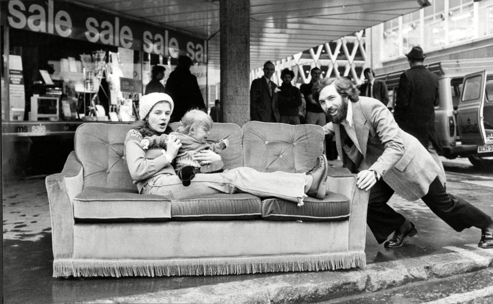  Mr Graham Freeman and his family with their sofa which was reduced in the Debenhams Of Oxford Street Sale