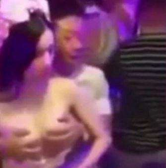  The bizarre footage showed a woman in a bride's outfit being groped by men