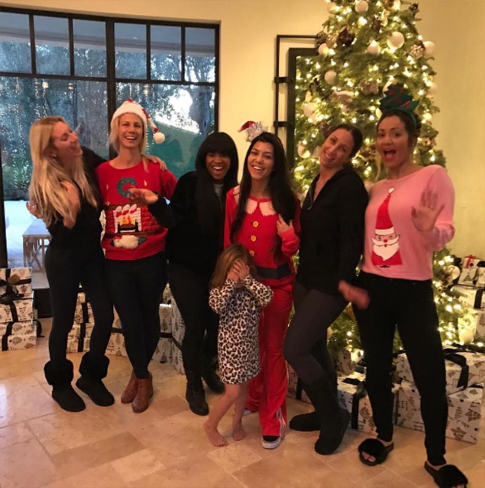  Kourtney Kardashian went for a comfier outfit in a Santa sweatshirt and tracksuit bottoms