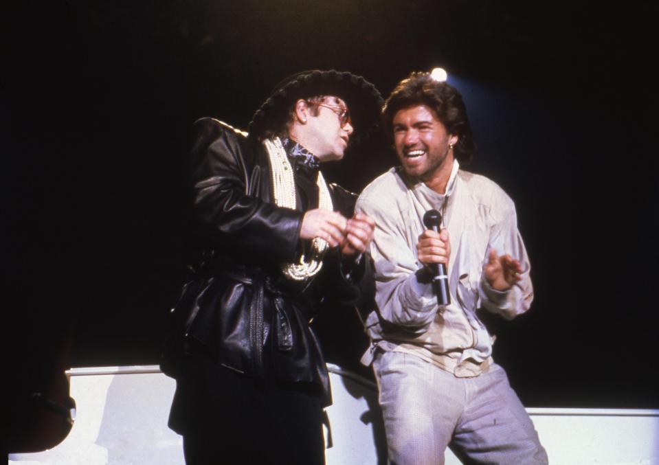  Elton John performing with George Michael