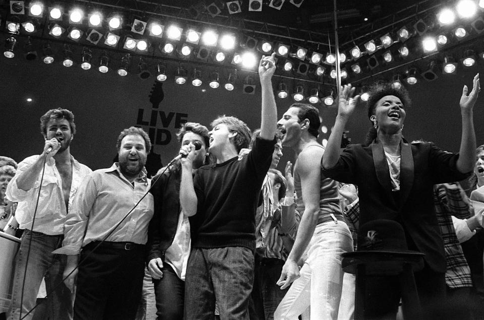  George Michael, concert promoter Harvey Goldsmith, Bono of U2, Paul McCartney, Freddie Mercury and more join in the finale of the Live Aid famine relief concert