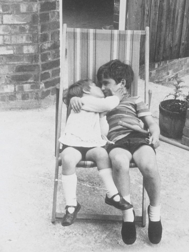  Young George, aged 5, poses for a picture with a friend