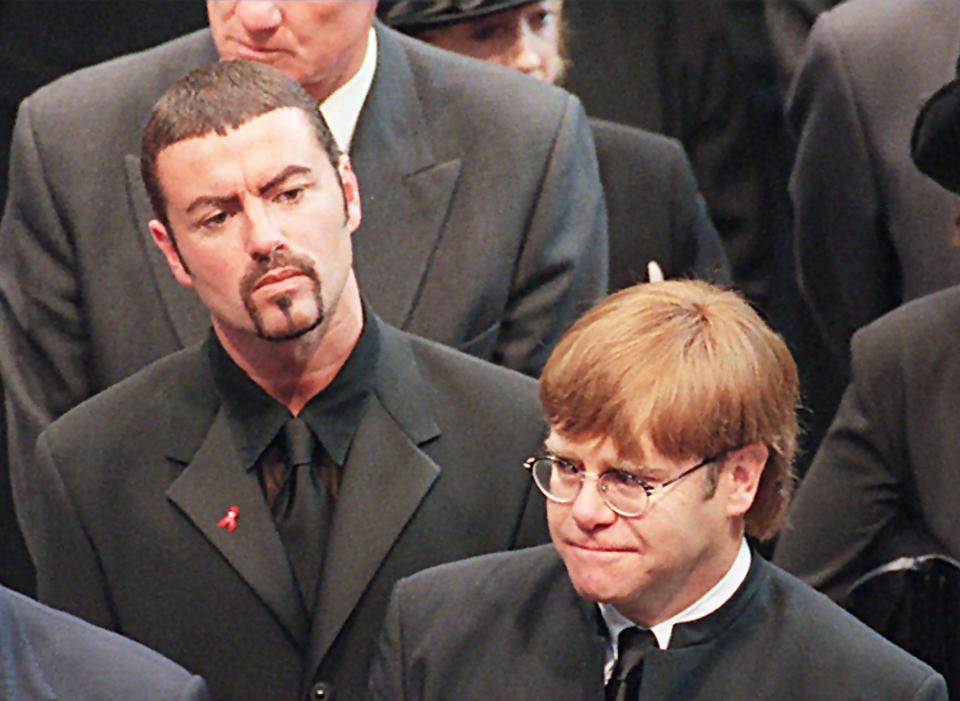  George is pictured here with Elton John at Princess Di's funeral