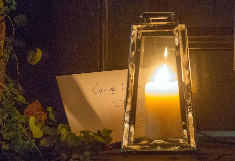  Tributes left outside the north London home of pop superstar George Michael this morning