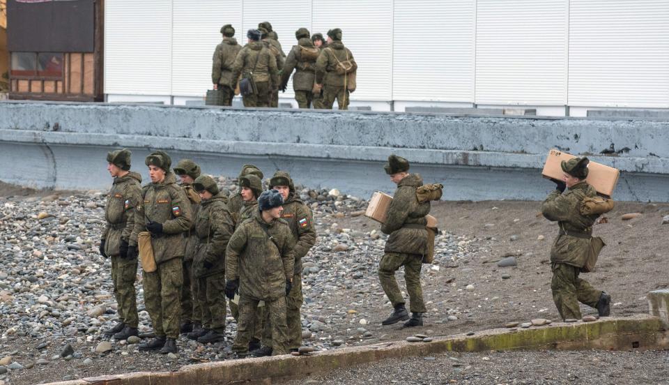  Soldiers patrol the coastline near where the plane crashed south of Sochi