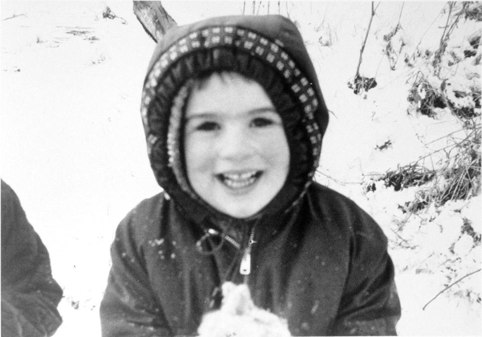  Smile George Michael poses for a winter snap in this photo from his family album