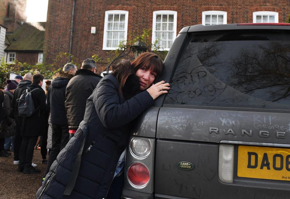  An emotional fan hugs Range Rover outside the star's home