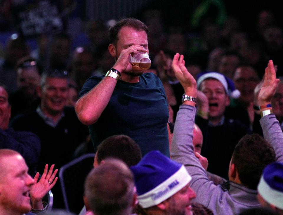 Danny Willett joined in the fun at the darts by necking a pint