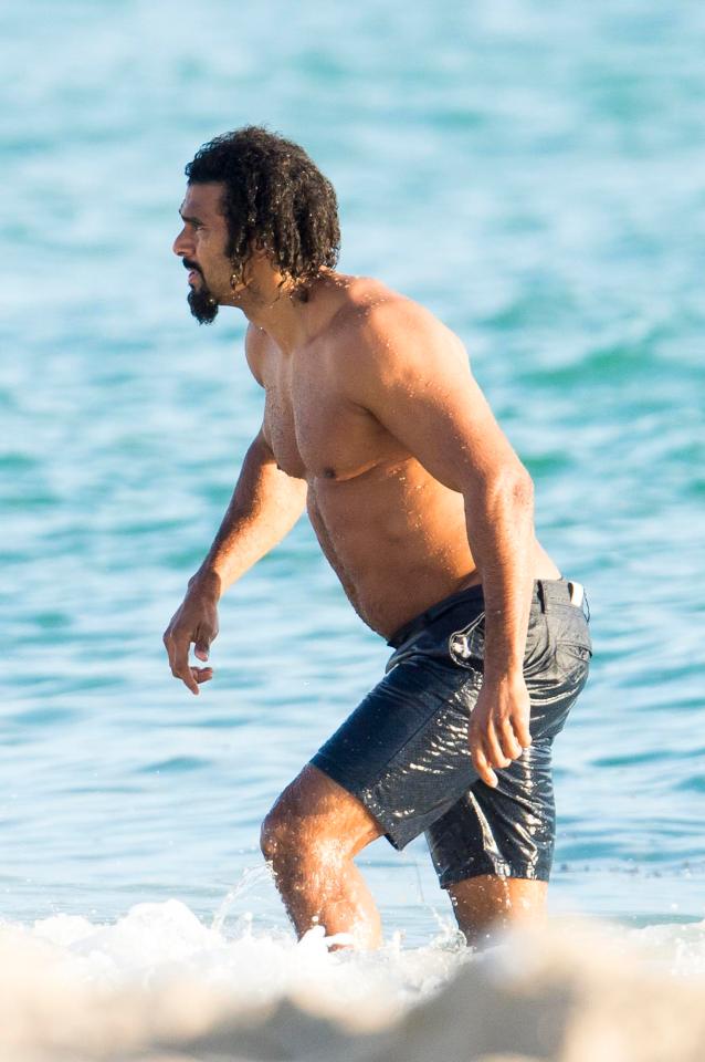  David Haye's abs appear not to be at their washboard best as he steps out of the sea