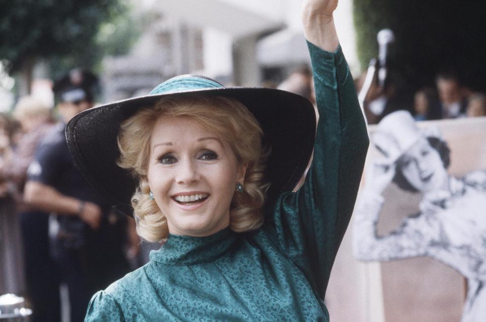  Reynolds waves for the cameras at a Hollywood Walk Of Fame ceremony in 1984