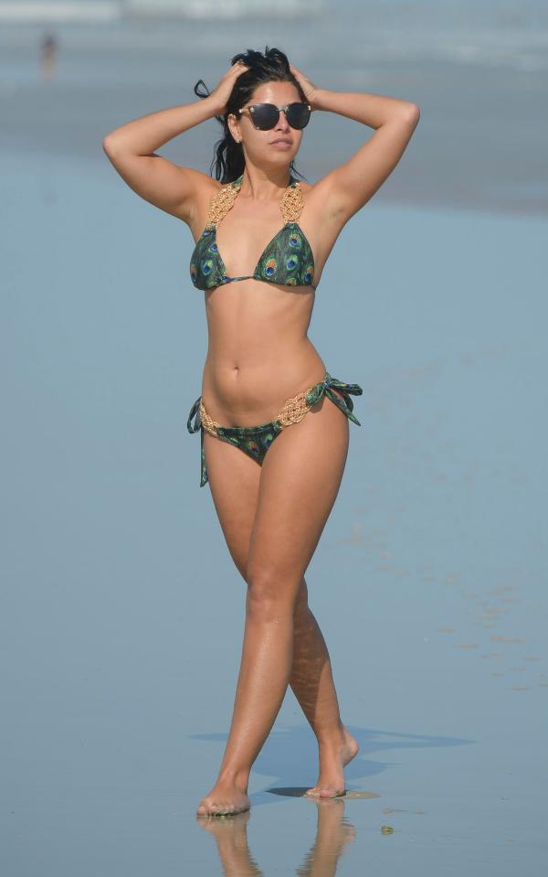 Cara flaunted her incredible curves in a sexy peacock print bikini