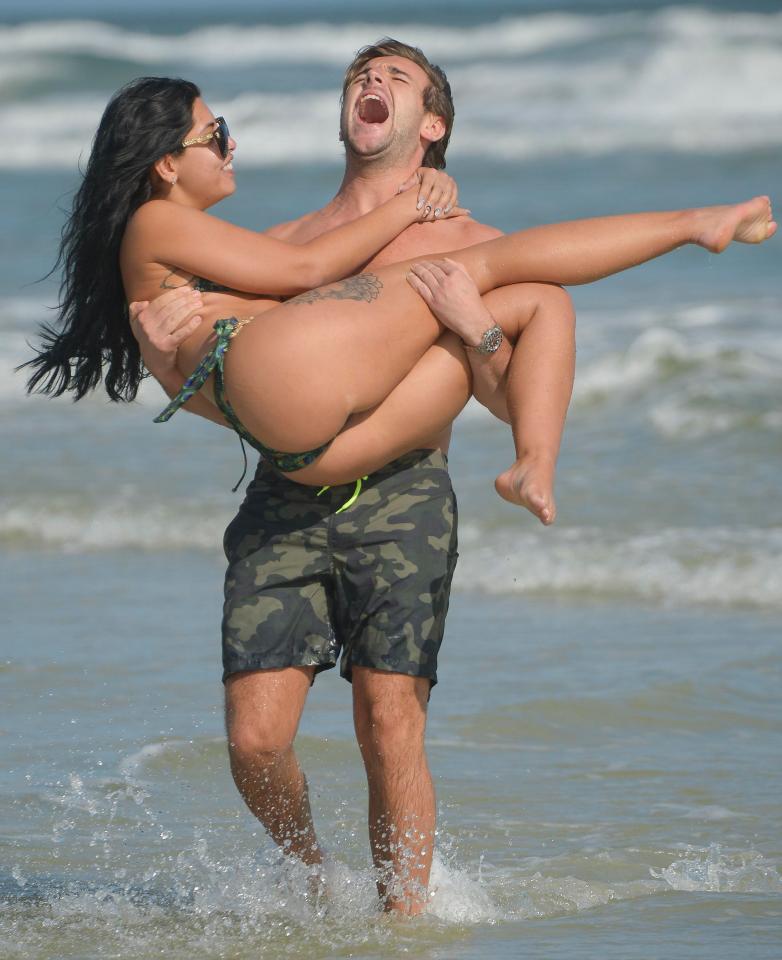 Nathan couldn't keep the smile off his face as he swung Cara around on the beach