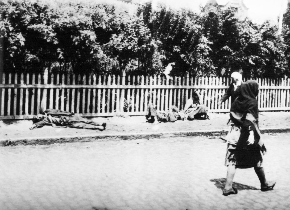  Women walk past people dying of starvation during the great Ukrainian famine of early 1930s.