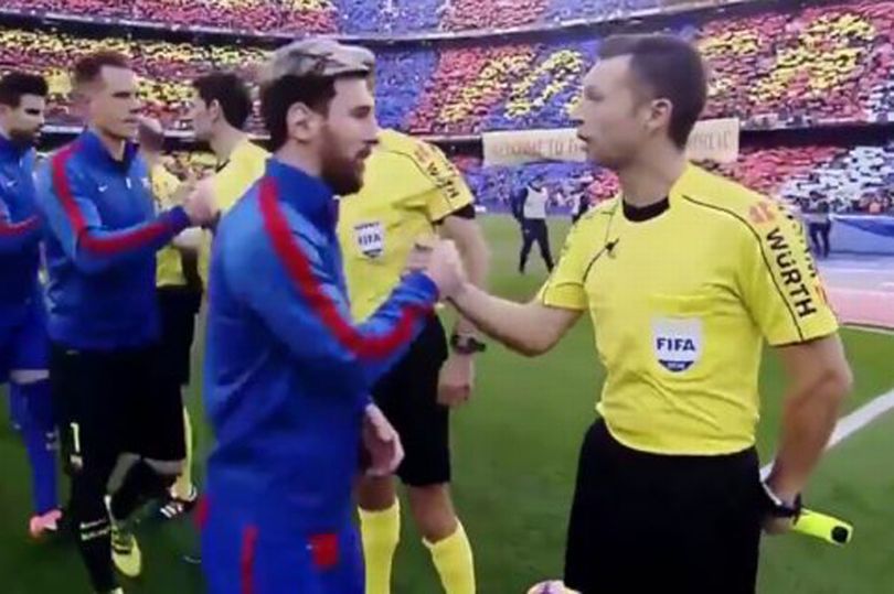 Pau Norbert Cebrian Devis shakes hands with Messi before the game