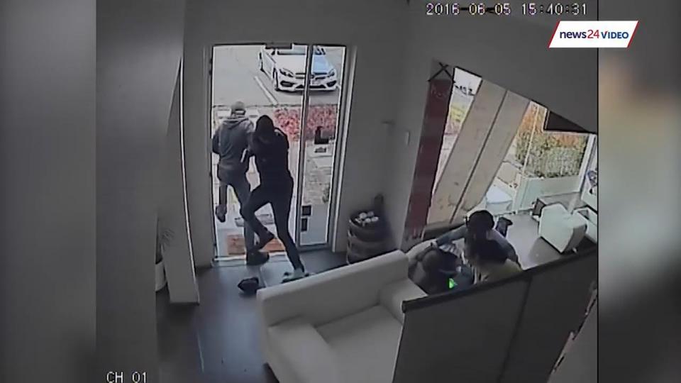  Video shows his wife and a spa employee as the real heroes pushing out the attackers, while the 'hero cop' cowers on the floor