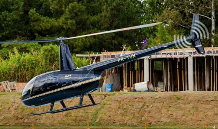 The bride had hired a Robinson R44 model helicopter to arrive to her wedding in 