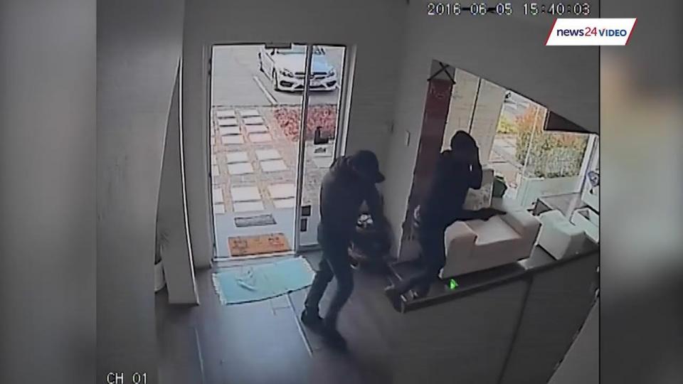  CCTV footage only just released shows two armed robbers entering the spa in Johannesburg, on June 5 earlier this year