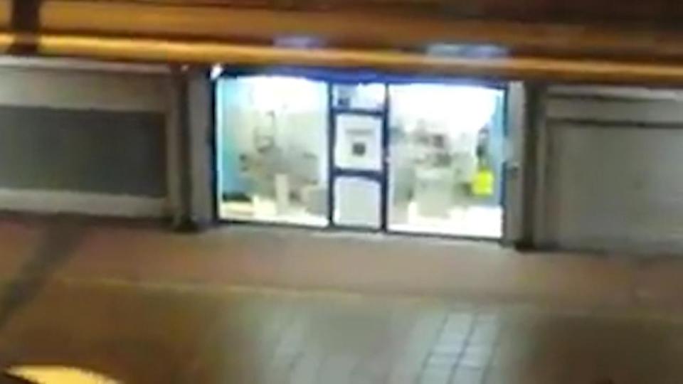  Video taken from a building opposite the bookies appeared to show newspaper taped to the shopfront in an apparent bid to obscure the view of police outside