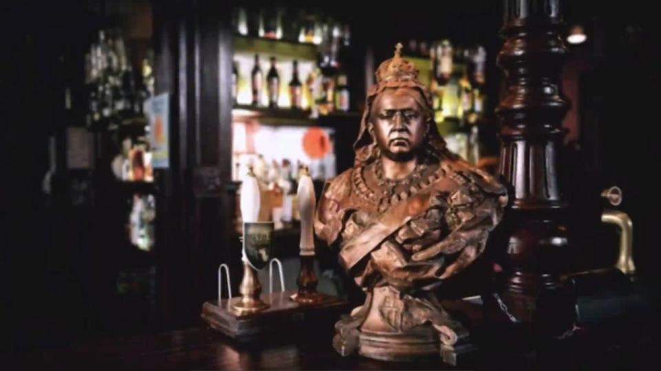  The video shows the bust of the Queen Vic on top of the bar