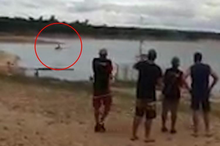  The crowd watch on in horror as the aircraft plunges towards the water