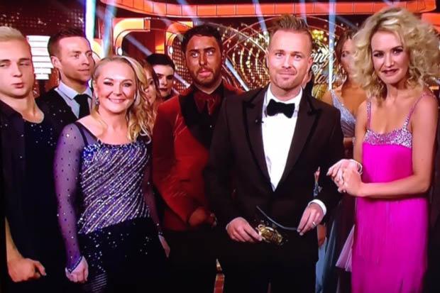  Hughie's tan was distinctly darker than the other contestants and host Nicky Byrne