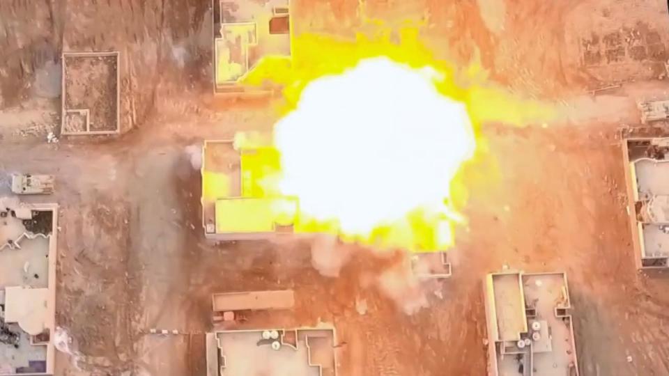 Cars can be seen driving up to military targets before exploding in a ball of flames