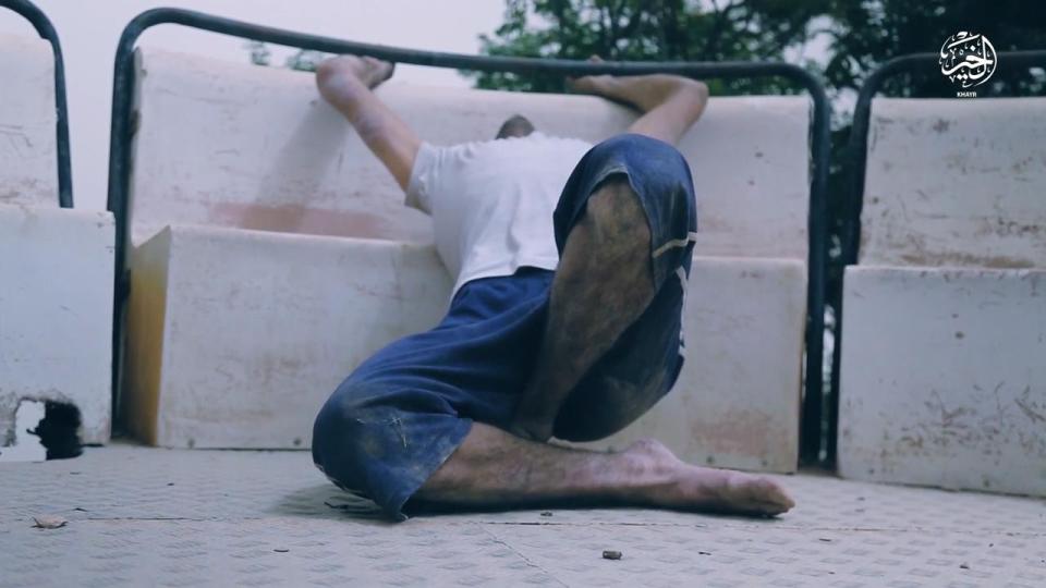  One of the victims, thought to be Kurdish, is filmed tied up in the abandoned amusement park