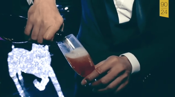 The out-of-favour Manchester United player then pours himself a glass of what appears to be pink Champagne