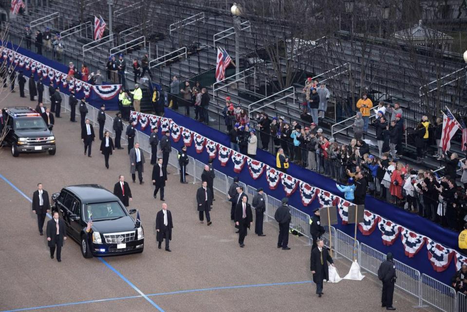  The presidential limousine drove behind the family, empty