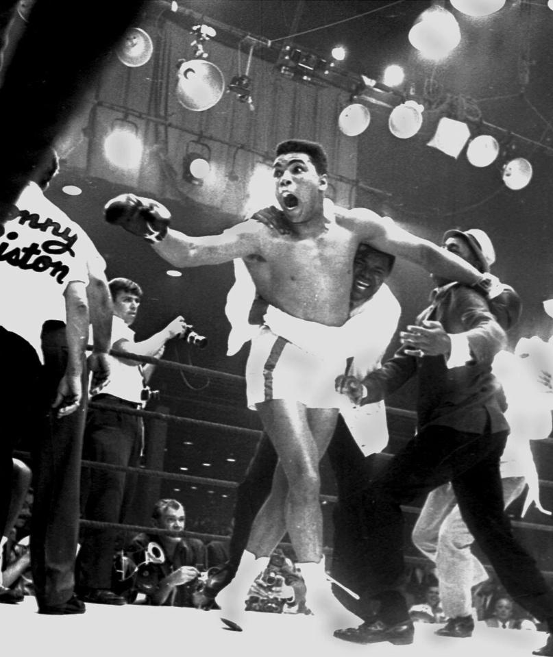 Muhammad Ali, or as he was known in February 1964 as Cassius Clay, celebrates after defeating Cassius Clay and becoming the heavyweight world champion