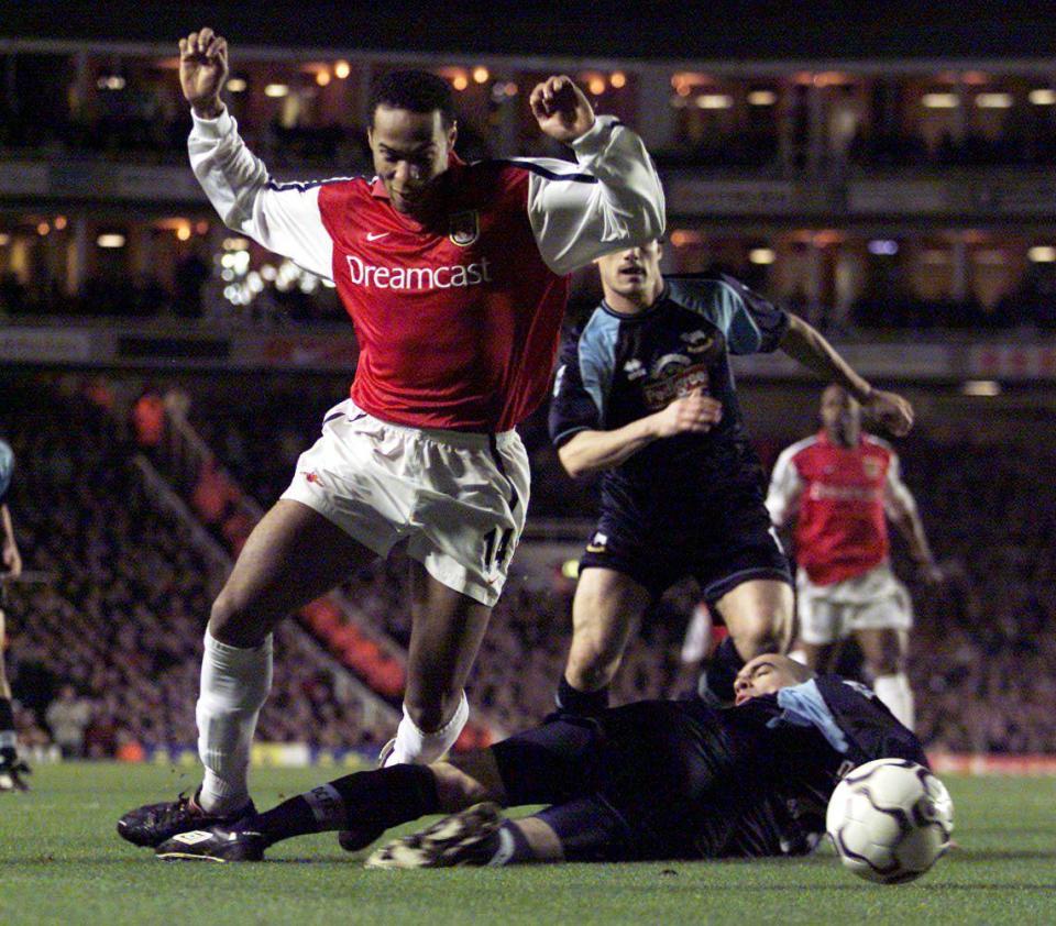  Higginbotham goes to tackle Arsenal legend Thierry Henry