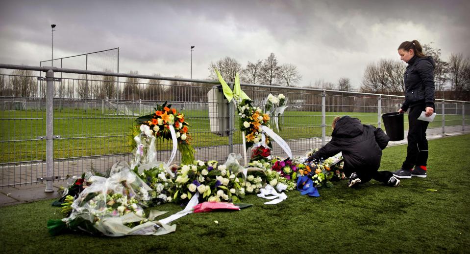  People lay flowers for linesman Richard Nieuwenhuizen who collapsed and fell into a coma after he was attacked by three Moroccan teenagers