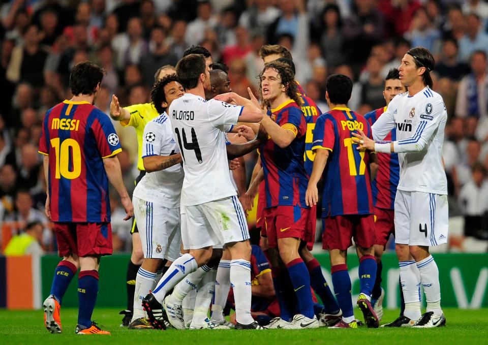  Real Madrid and Barcelona players square up during heightened Clasico rivalry